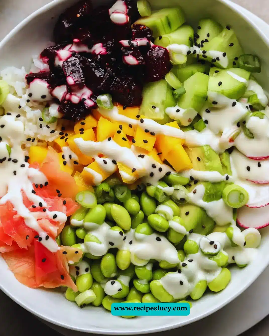 Delicious Beet Poke Bowls topped with fresh vegetables and sauce