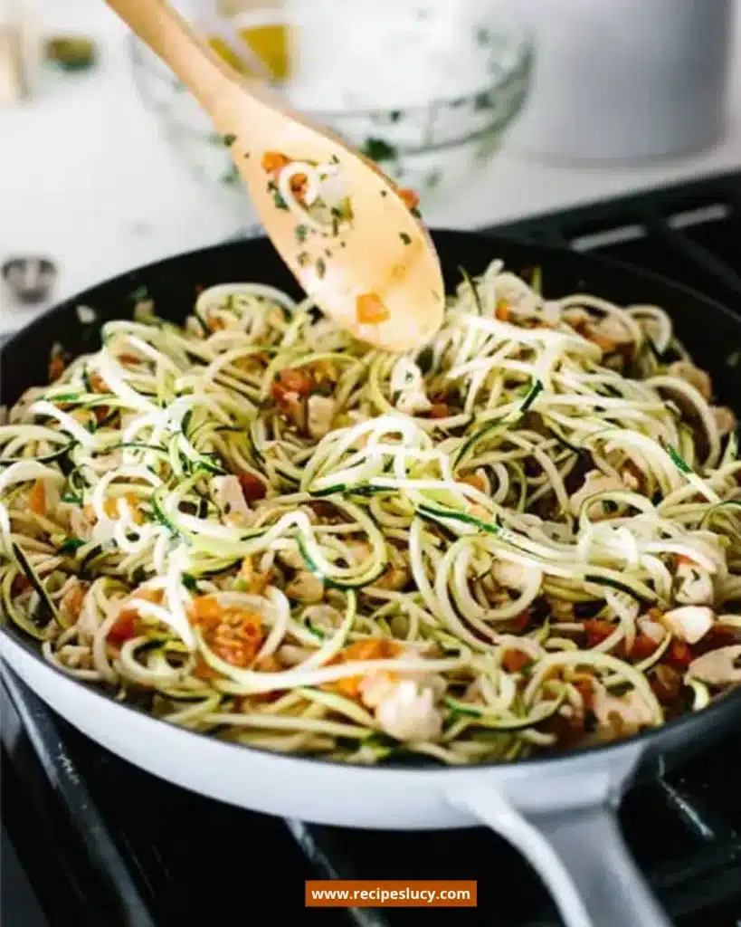 Plate of Mexican chicken zucchini noodles topped with fresh herbs