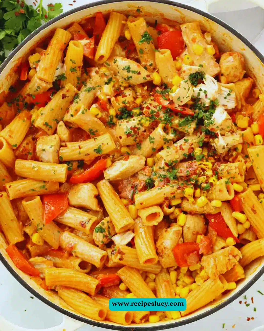 Bowl of creamy peri peri chicken pasta with vibrant vegetables and spices