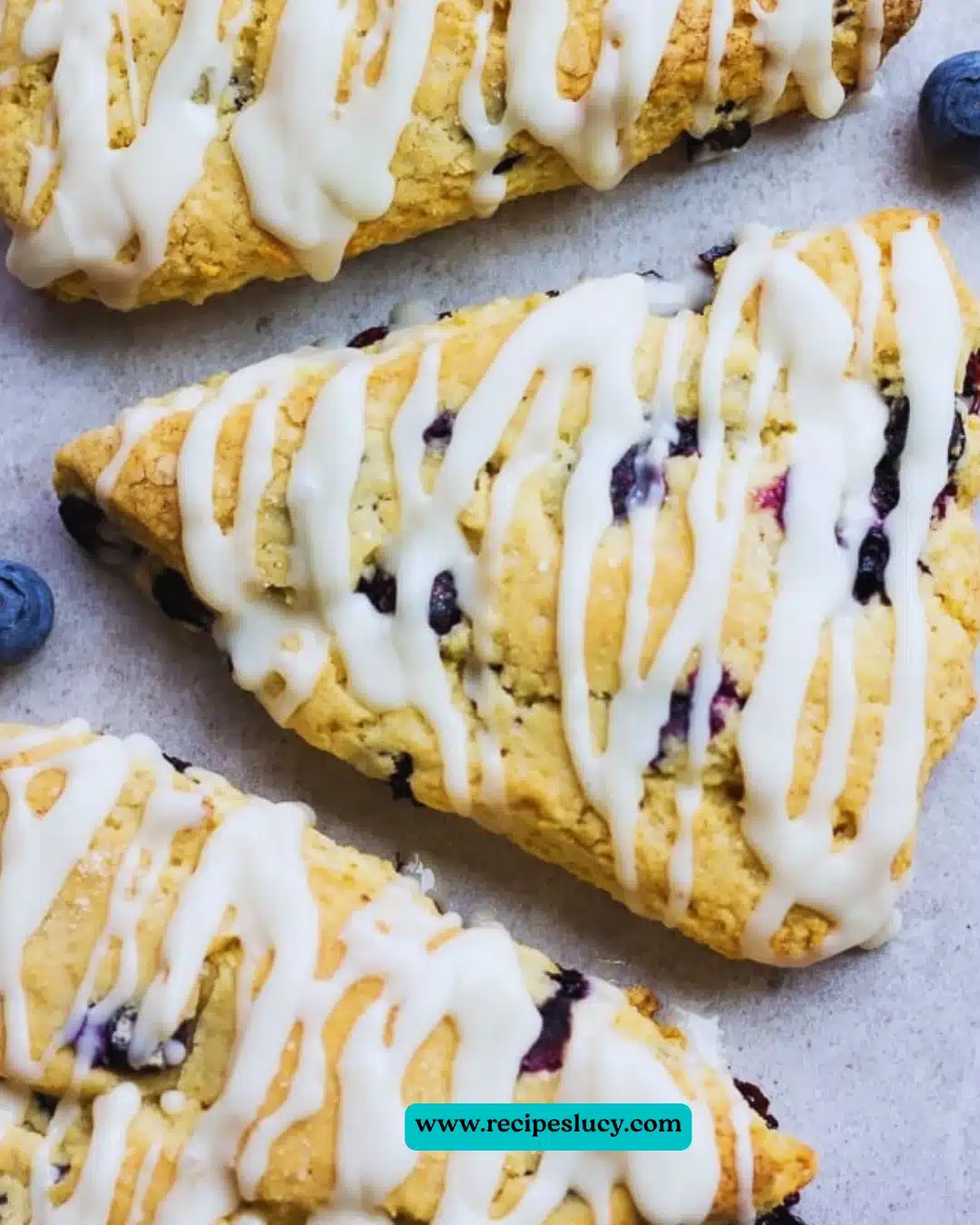 Vegan blueberry scones on a plate, fresh and golden brown.