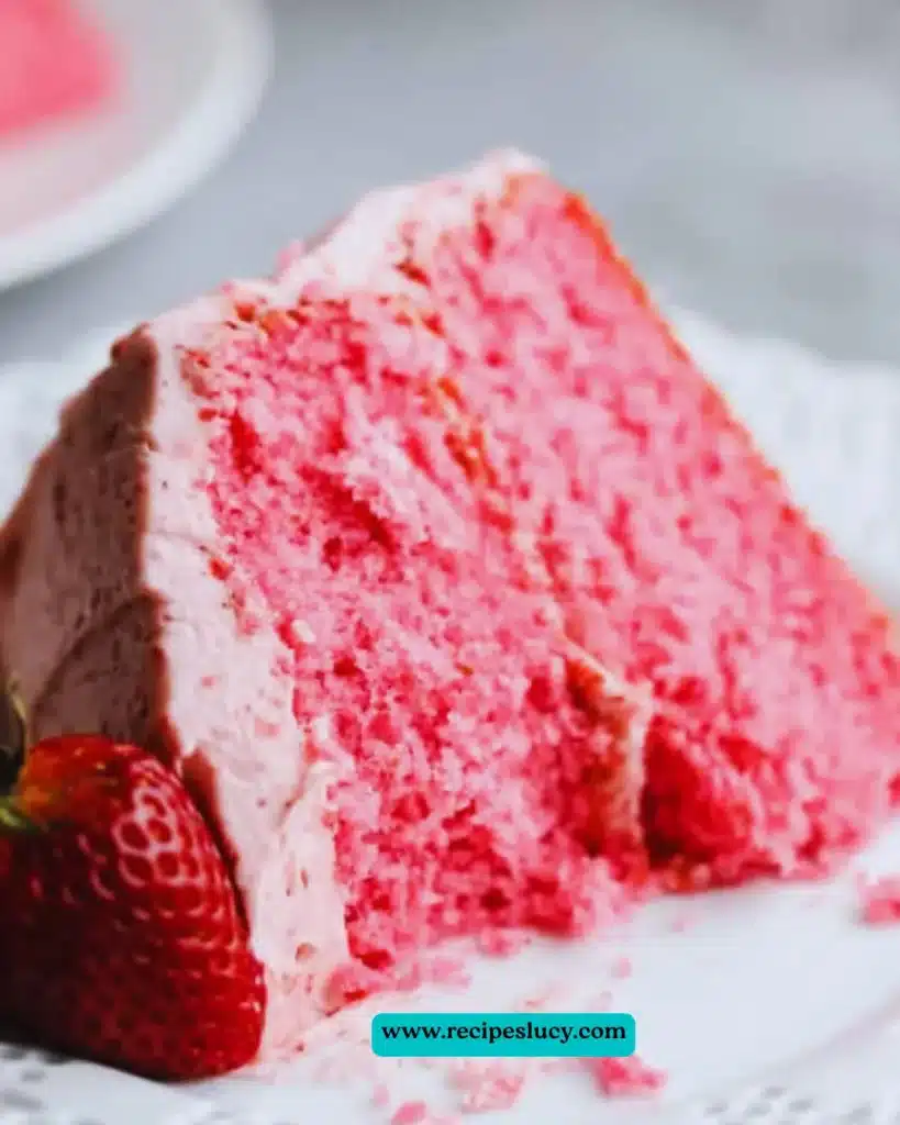 Delicious Vegan Strawberry Cake topped with fresh strawberries and coconut cream