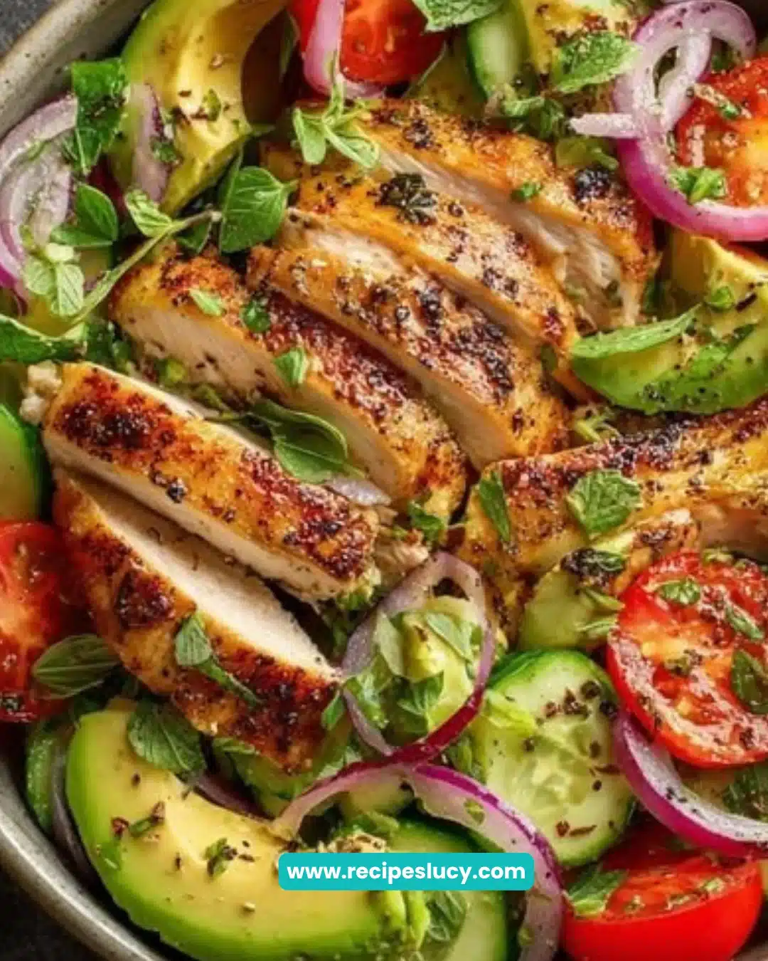 Delicious grilled chicken avocado salad with fresh vegetables and dressing