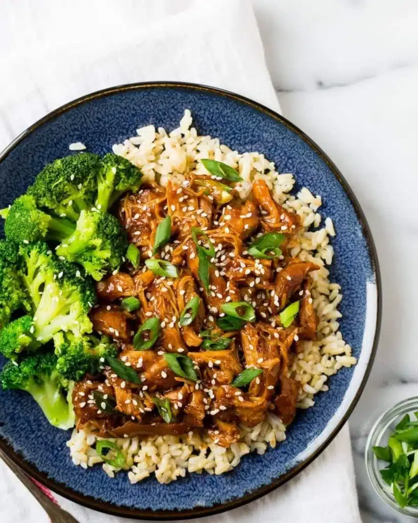 Slow Cooker Honey Garlic Chicken with tender meat and a sweet glaze