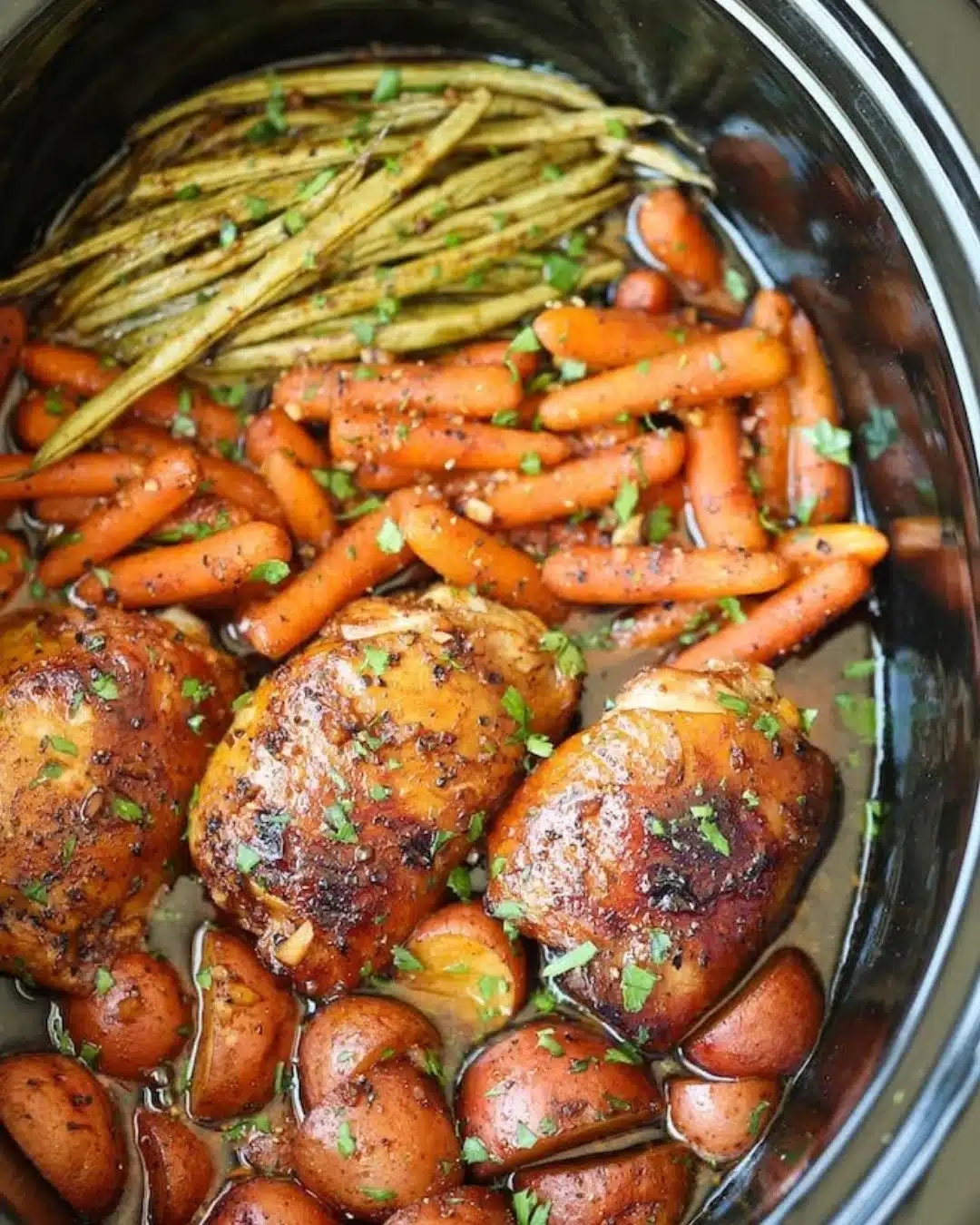 Slow Cooker Honey Garlic Chicken served with colorful vegetables