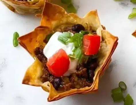 Easy taco cups recipe with flavorful ingredients in crispy tortilla shells.