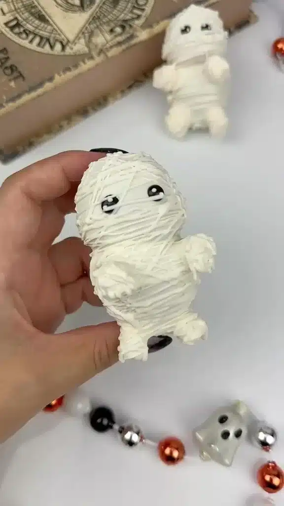 Delicious strawberry mummies with candy eyes for Halloween treats