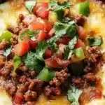 Delicious queso fundido with chorizo served in a warm dish