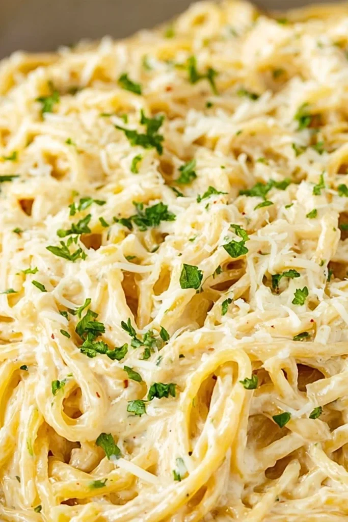 Delicious bowl of easy cream cheese pasta garnished with herbs