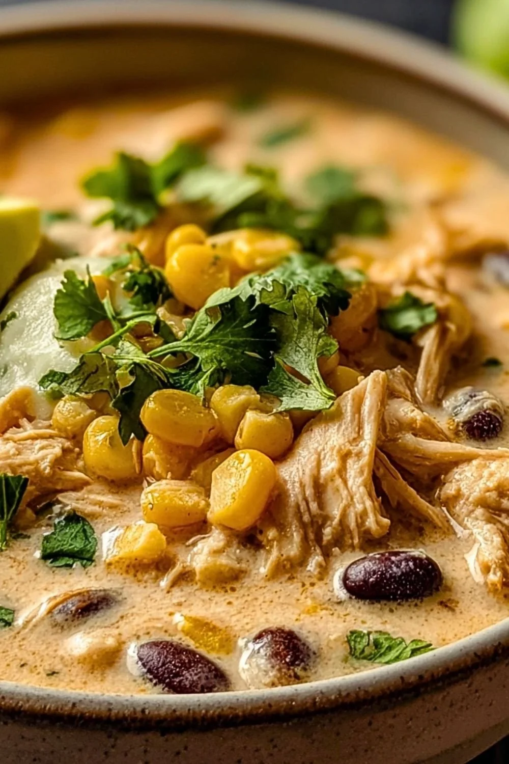 Delicious creamy white chicken chili with cream cheese served in a bowl
