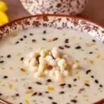 Bowl of decadent Makhana Kheer topped with nuts and raisins