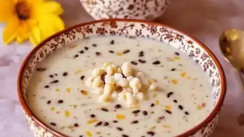 Bowl of decadent Makhana Kheer topped with nuts and raisins