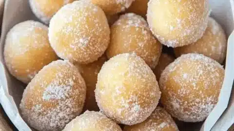 Homemade decadent Portuguese doughnuts (Sonhos) on a plate