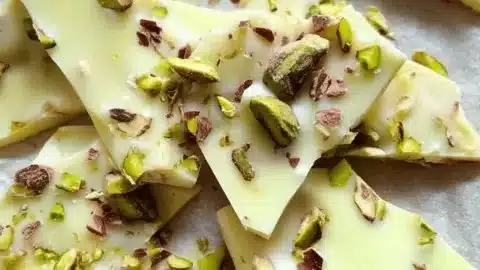 Delicious white chocolate-pistachio bark displayed beautifully on a platter
