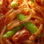 Delicious longevity noodles with snow peas and crunchy chestnuts in a bowl