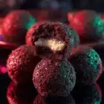 No-bake Christmas Oreo cheesecake truffles on a festive plate