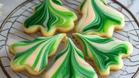 Plate of marbled sugar cookies with vibrant swirls of color.