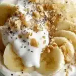 Delicious Banana Cream Pie Overnight Oats topped with banana slices and whipped cream
