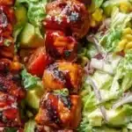 BBQ Chicken Skewer Salad with creamy avocado dressing on a plate