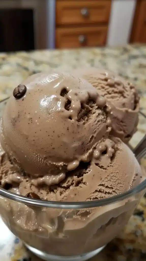 Scoop of bold coffee ice cream with rich coffee flavor and creamy texture