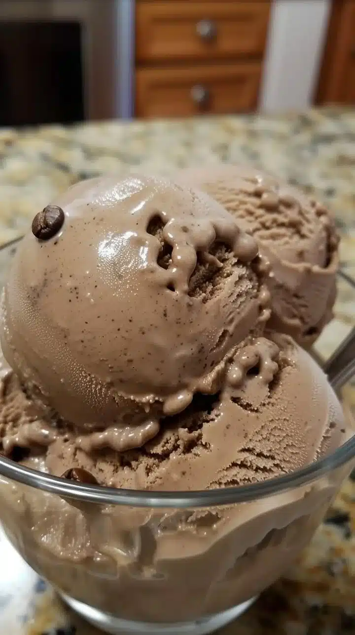Scoop of bold coffee ice cream with rich coffee flavor and creamy texture