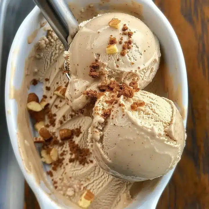 Delicious brown sugar cinnamon ice cream in a bowl with a sprinkle of cinnamon