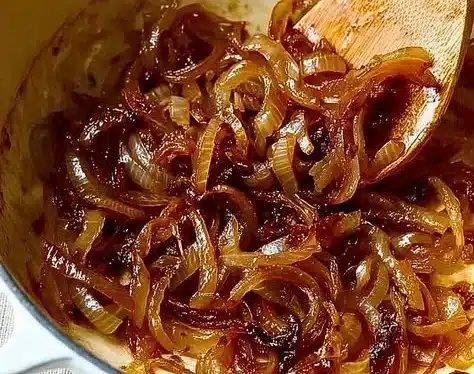 Delicious caramelized onions in a skillet, ready to enhance any dish.