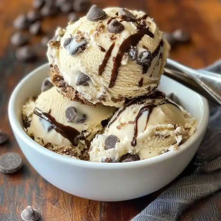 Chips Ahoy Ice Cream in a bowl with cookie pieces and chocolate swirls