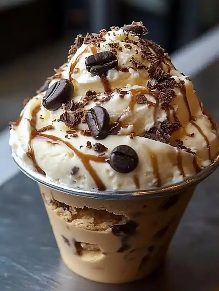 Delicious coffee ice cream served in a bowl with coffee beans on the side