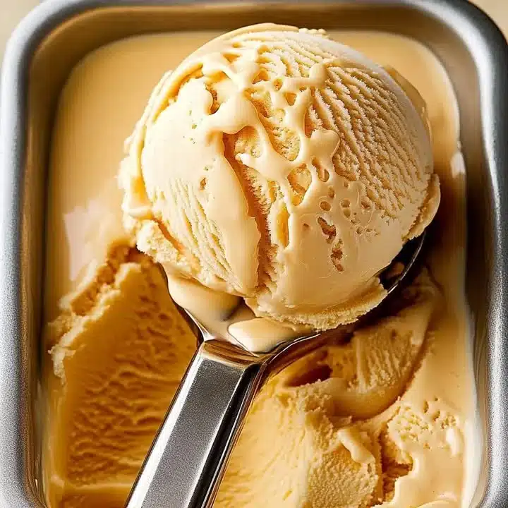 Delicious Dulce de Leche ice cream in a bowl topped with caramel drizzle