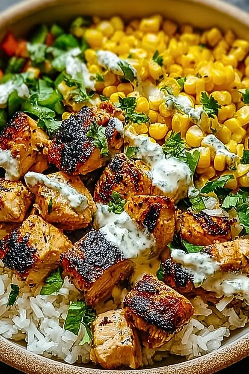 Healthy chicken rice bowl with street corn and fresh ingredients