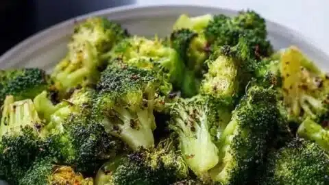 Crispy air fryer broccoli with high protein content served in a bowl