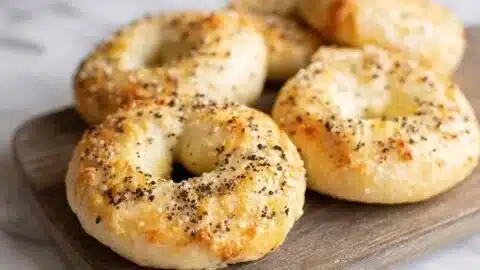 Delicious high protein cottage cheese bagels on a wooden board