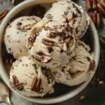 Delicious homemade butter pecan ice cream served in a bowl