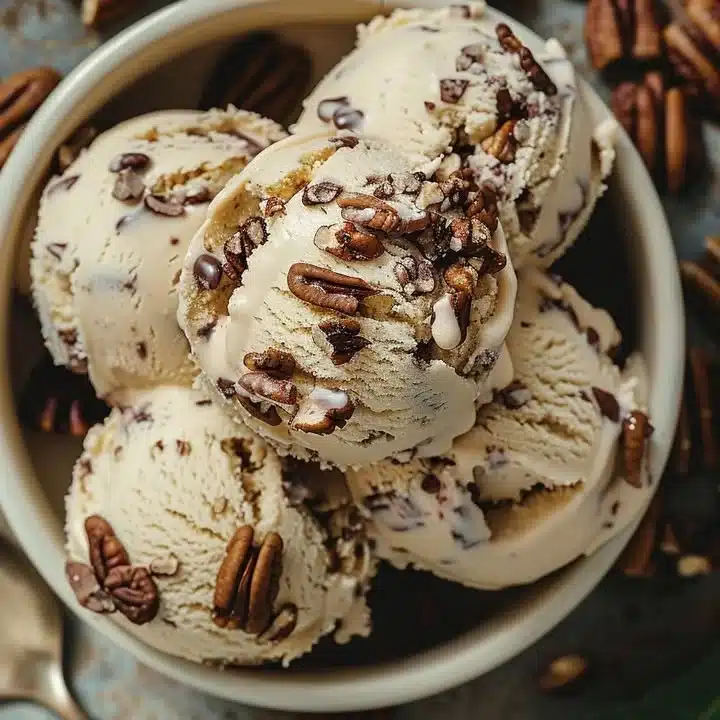 Delicious homemade butter pecan ice cream served in a bowl