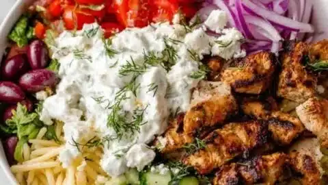 Delicious homemade chicken gyro bowl with fresh vegetables and tzatziki sauce
