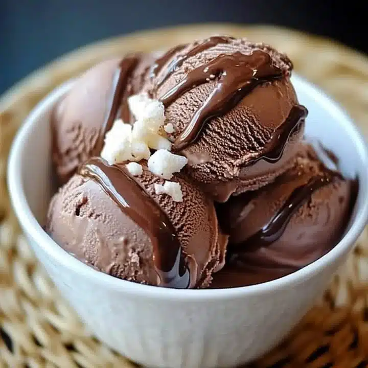 Homemade chocolate ice cream in a bowl with chocolate shavings on top