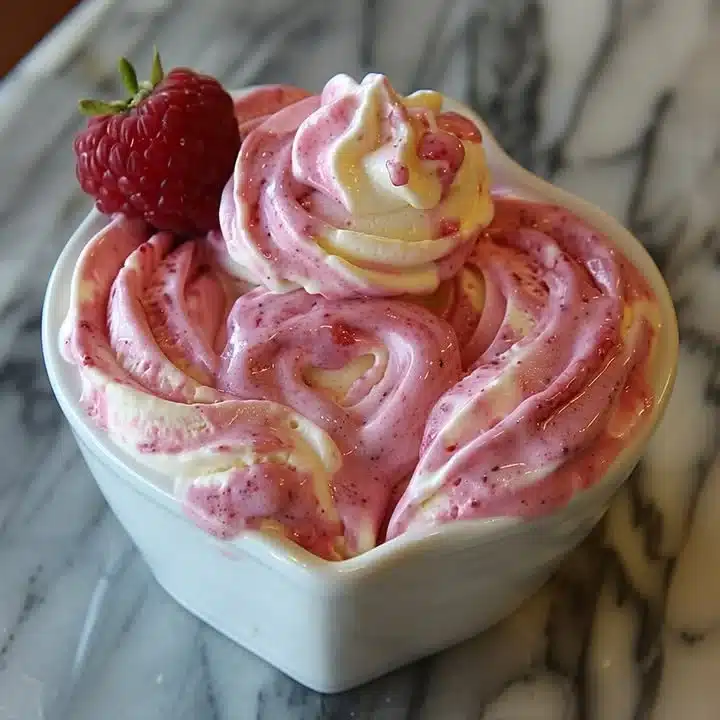 Delicious homemade sweetheart swirl ice cream in a bowl with colorful swirls