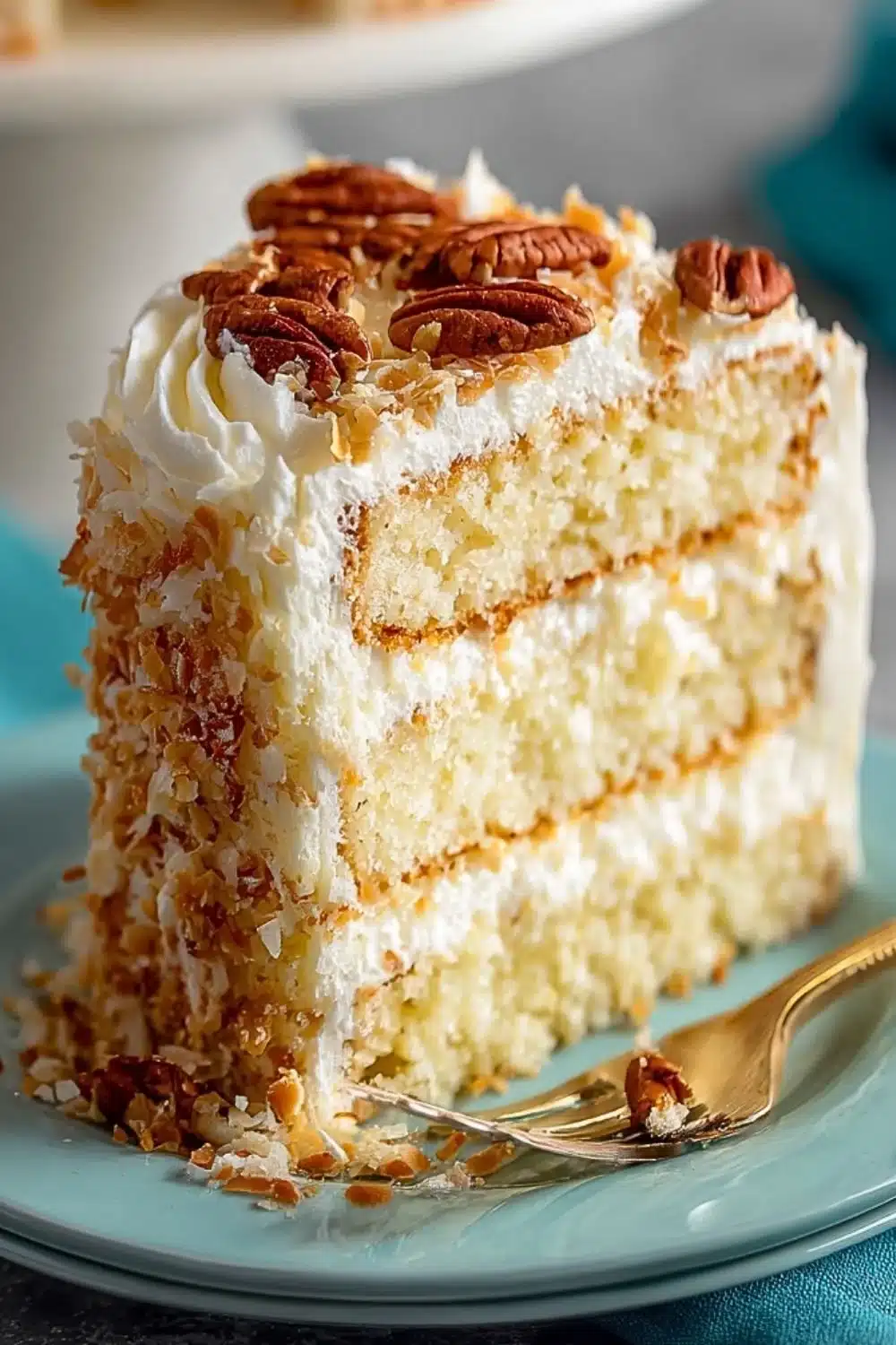 Homemade Italian Cream Cake with cream cheese frosting, coconut, and pecans