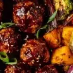 Korean BBQ meatballs with colorful roasted vegetables on a plate