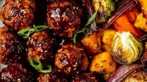 Korean BBQ meatballs with colorful roasted vegetables on a plate