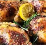 Oven roasted lemon garlic and parmesan cornish hens garnished with herbs