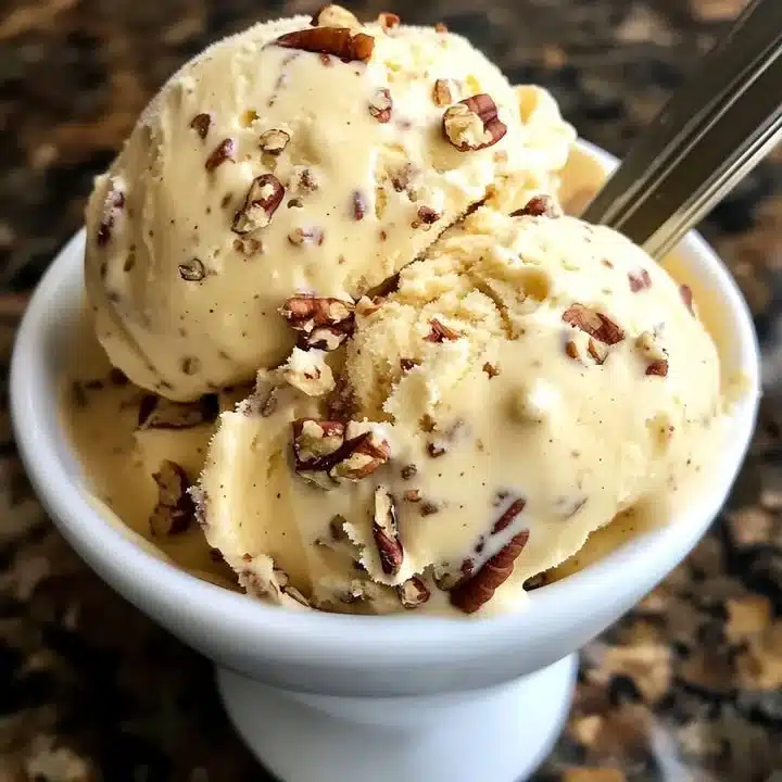 Delicious bowl of Passionfruit Pecan Ice Cream with nuts and tropical fruit