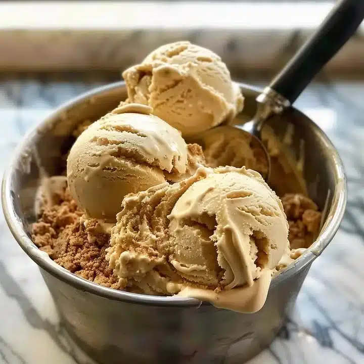 Rich and creamy butterscotch ice cream in a cone.