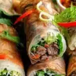 Delicious Thai Basil Beef Rolls served with fresh vegetables