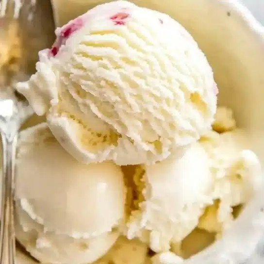 Delicious scoop of creamy vanilla ice cream in a waffle cone