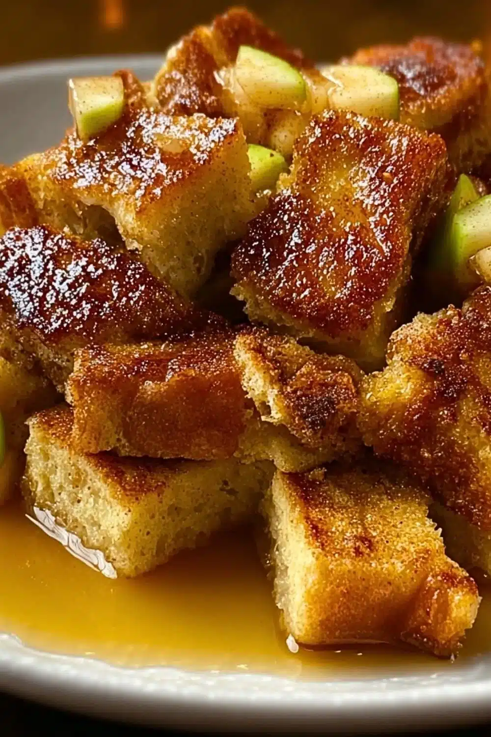 Delicious Apple Cinnamon French Toast Casserole topped with syrup and cinnamon