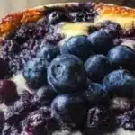 Baked blueberry cottage cheese bowls topped with fresh blueberries and nuts