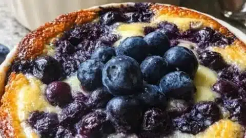 Baked blueberry cottage cheese bowls topped with fresh blueberries and nuts