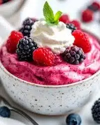 Delicious blueberry mousse made with cottage cheese, served in a glass.
