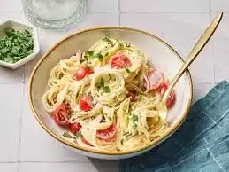 Boursin cheese stuffed mushrooms on a platter, garnished and ready to serve.